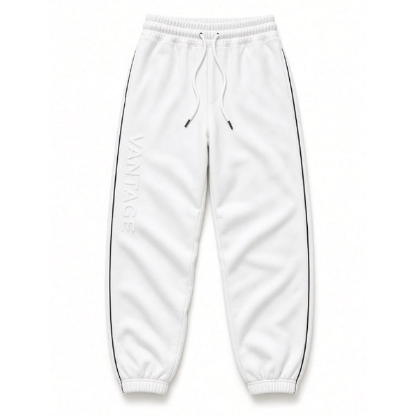 White jogger sweatpants with a vertical 'VANTAGE' logo printed on the left leg, featuring a drawstring waist and black side piping, shown against a plain white background.