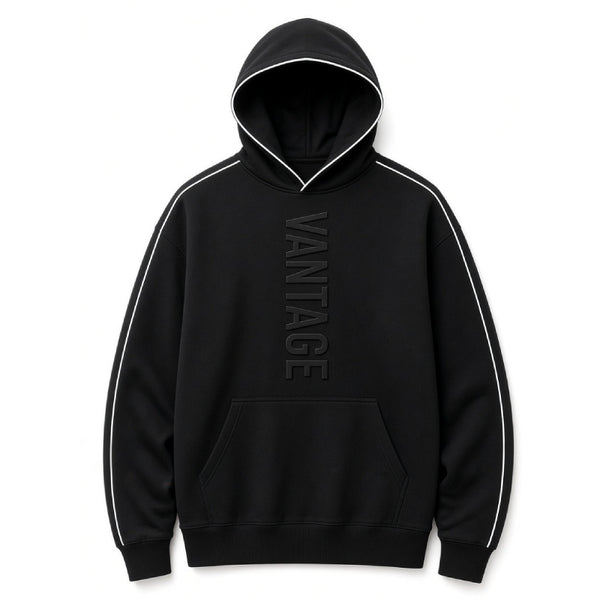A black pullover hoodie with white contrast piping along the hood, shoulders, and sleeves, featuring a tonal dark gray vertical 'VANTAGE' logo on the chest and a front kangaroo pocket.